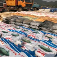 Precursor chemicals used to make illicit drugs such as methamphetamine, ketamine, heroin and fentanyl seized by Myanmar police and military are seen in this undated photo near Loikan village in Shan State between February and April 2020 in what the United Nations Office on Drugs and Crime described as Asia\'s biggest-ever drug bust.  | MYANMAR POLICE / UNODC / VIA REUTERS