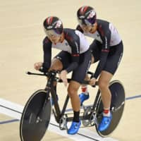 Cyclist Kazuhei Kimura (right) and his pilot Takuto Kurabayashi participate in the 2018 Asian Para Games in Jakarta. | KYODO