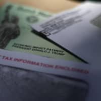 U.S. President Donald Trump\'s name is printed on a stimulus check issued by the U.S. government to help combat the adverse economic effects of the COVID-19 outbreak. | AP