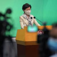 Hong Kong Chief Executive Carrie Lam listens to reporter\'s question during a news conference in the city Tuesday. | AP