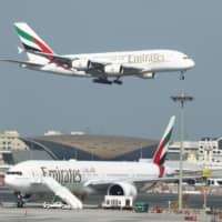 Emirates Airlines Airbus A380-800 plane approaches for landing at Dubai Airports in Dubai. | REUTERS