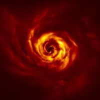 Close to the center of this image, in the inner region of the disc, a twist (in very bright yellow) is seen that scientists believe marks the spot where a planet is forming.  ESO\'s Very Large Telescope spotted signs of the planet birth. The image was released Wednesday.  | 
ESO / BOCCALETTI ET AL/ VIA REUTERS