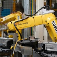 Fanuc Corp., a maker of robots used in factories for companies ranging from Apple to Amazon, saw orders in the fourth quarter to March climb 7 percent. | BLOOMBERG