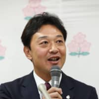 JRFU chaiman and Japan Sevens head coach Kensuke Iwabuchi speaks in a press conference to announce the Japan quad of rugby sevens on Dec. 20, 2019, in Tokyo. | KYODO
