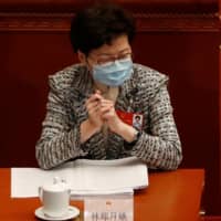 Hong Kong Chief Executive Carrie Lam attends the opening session of the National People\'s Congress in Beijing on Friday.  | REUTERS