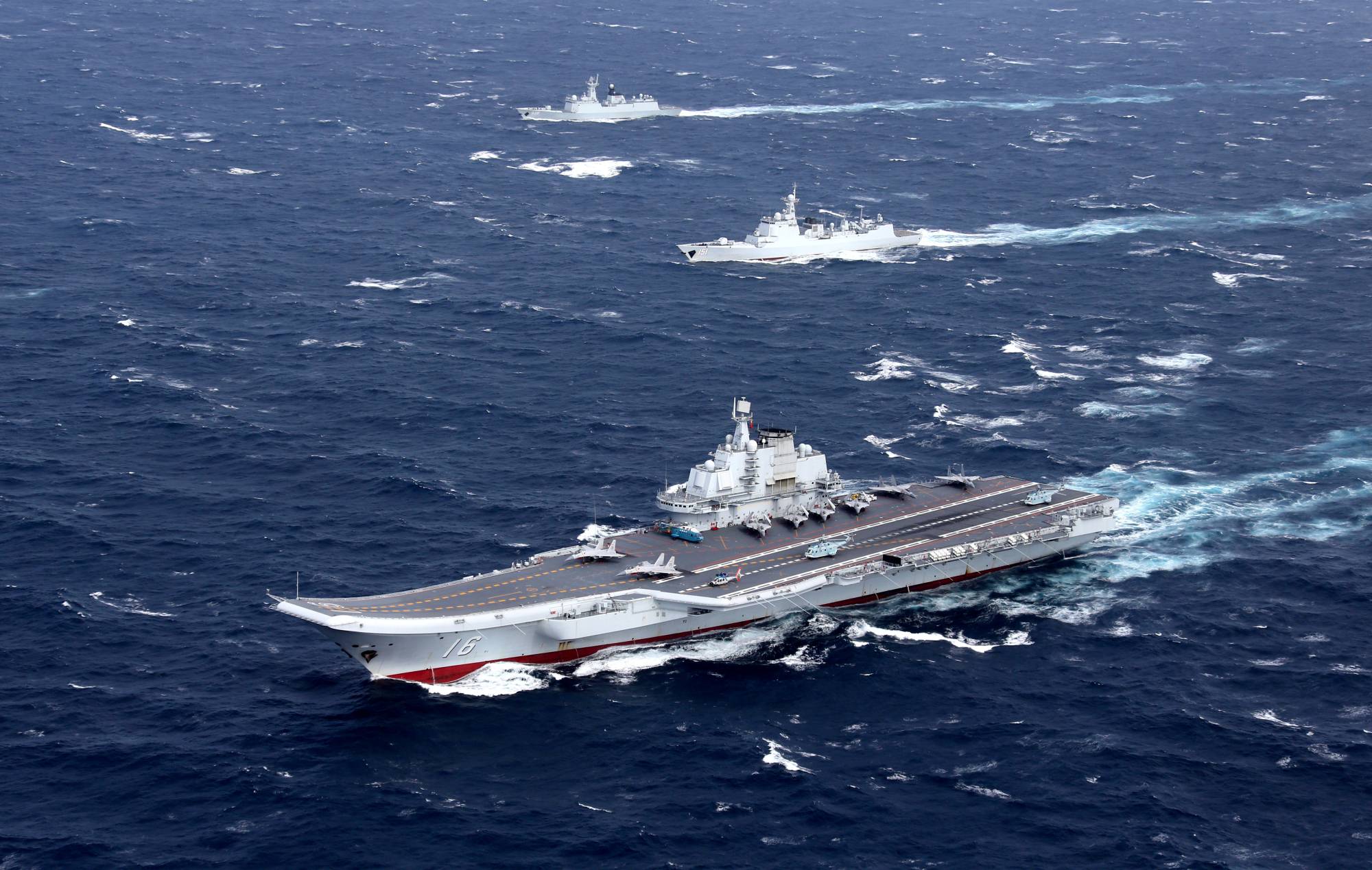 A Chinese Navy flotilla including the aircraft carrier Liaoning conducts exercises in the South China Sea. China claims most of the South China Sea and has militarized a number of artificial islands there. | REUTERS