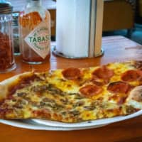 No frills: Pizza Slice sells fast and filling New York-style pizza for those days when you’re just looking for something tasty. | OSCAR BOYD
