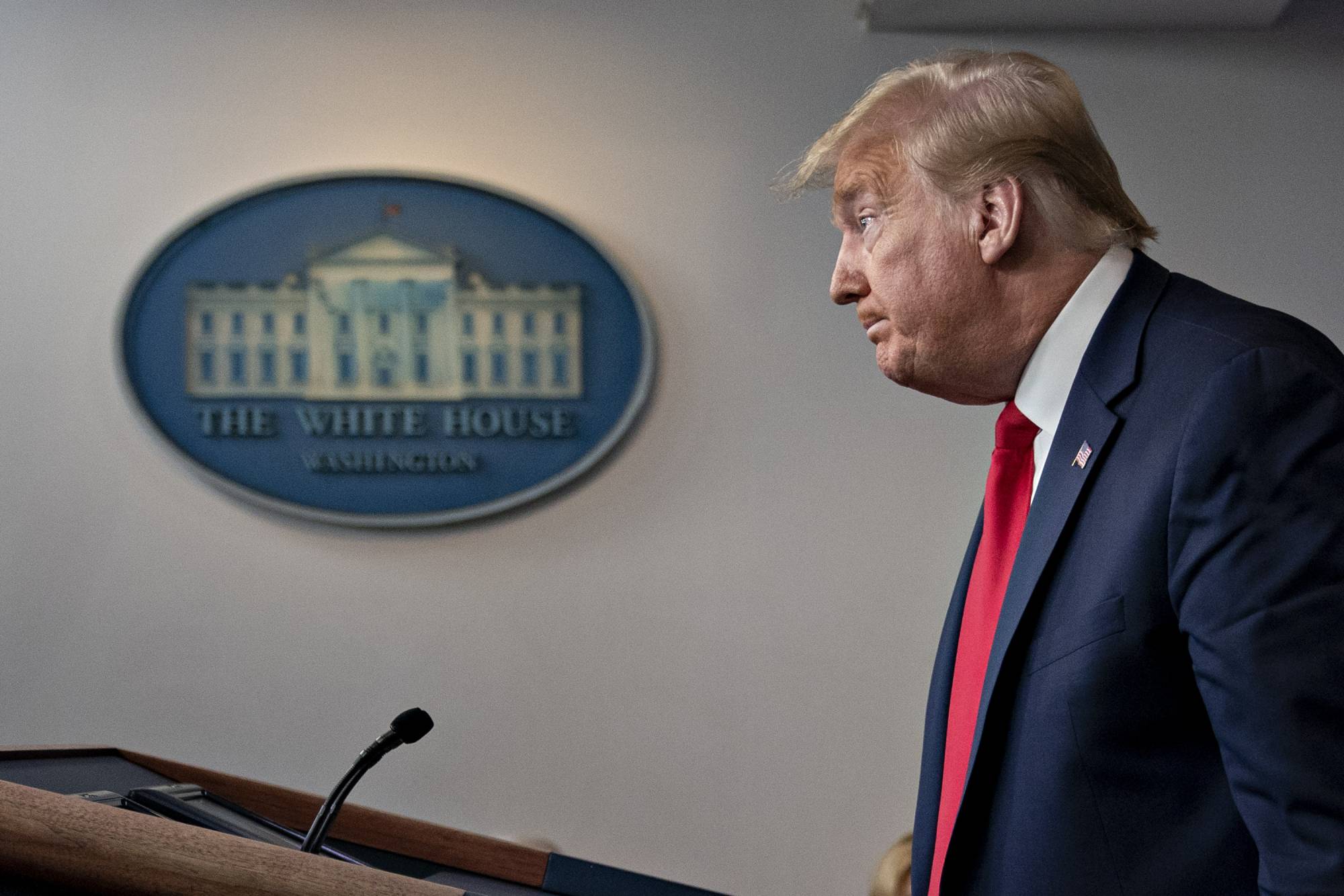 U.S. President Donald Trump pauses after speaking during a news conference at the White House in Washington on Friday. | BLOOMBERG