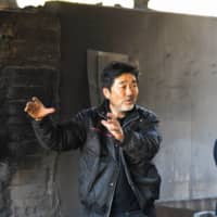 Shinji Sato shows his charcoal production studio in the city of Shima on Feb. 24. 