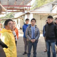 Sato Yoshokujo Ltd. President Fumihiko Sato explains about his oyster farm to the participants of a study tour co-hosted by the Japan Times Satoyama Consortium and the city of Shima in the city on Feb. 24.