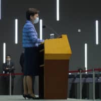 Hong Kong Chief Executive Carrie Lam listens to reporters\' questions during a news conference in Hong Kong on Tuesday. | AP