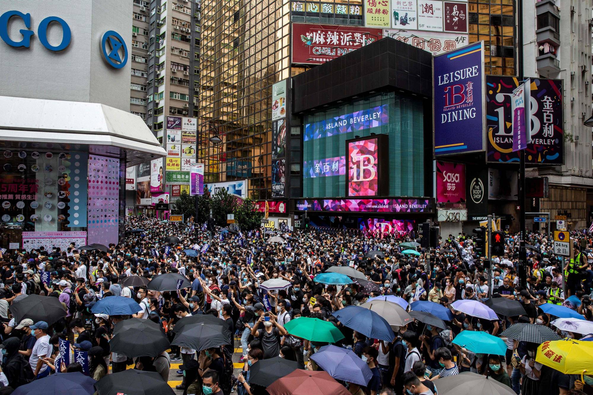Pro-democracy protesters gather in the Causeway Bay district of Hong Kong on Sunday.  | AFP-JIJI