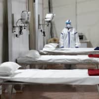 Beds are prepared at a hospital that has been constructed to treat COVID-19 patients in Mumbai, India, on Friday.  | REUTERS 