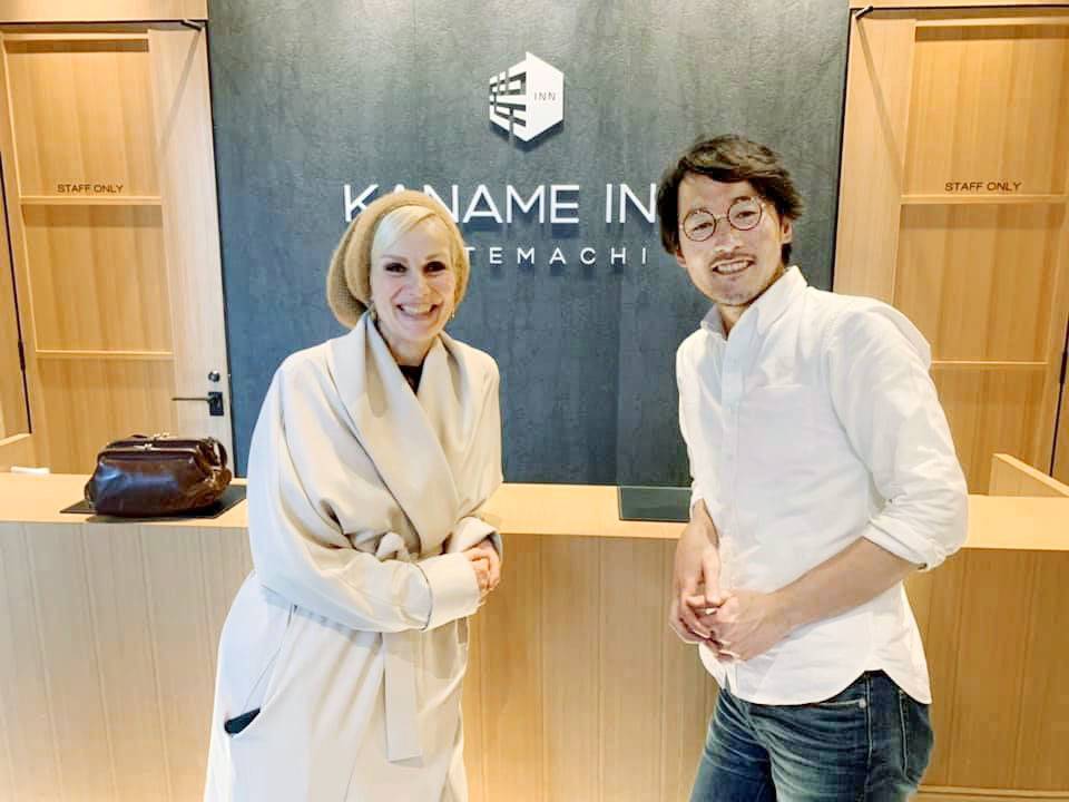 Hiroshi Hosokawa, CEO of Slacktide, and a Dutch visitor pose for a photo at Kaname Inn Tatemachi, which is providing free lodging to foreign travelers stuck in Japan due to the coronavirus pandemic, in Kanazawa, Ishikawa Prefecture, in March. | KYODO