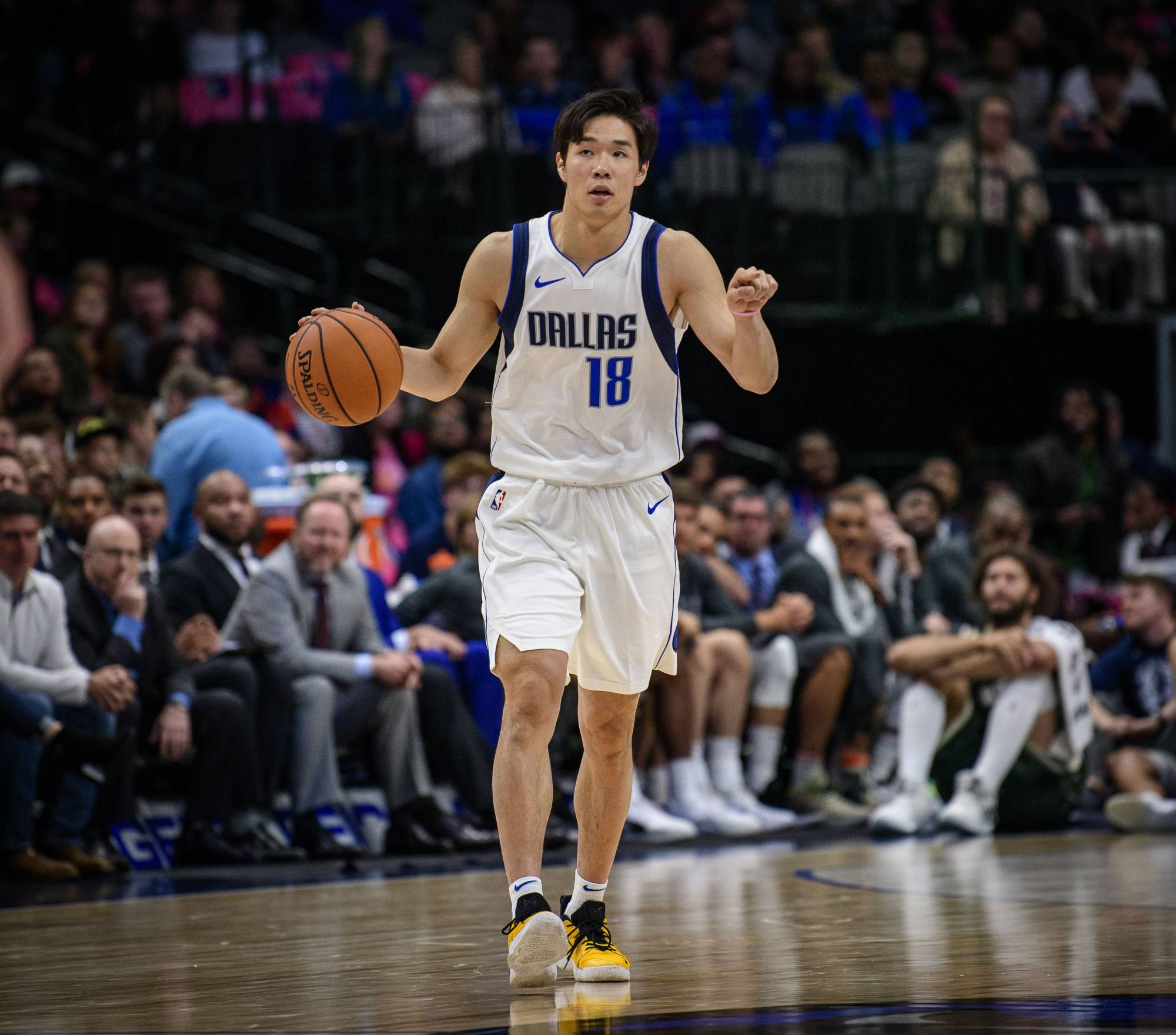 Yudai Baba dribbles the ball while playing for the Mavericks in a preseason game against the Bucks on Oct. 11 in Dallas. | USA TODAY / VIA REUTERS