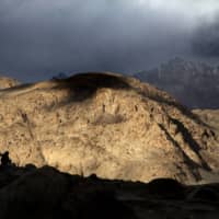 Border Roads Organization workers rest near Pangong Lake in Ladakh region, India, in September 2018. Indian and Chinese soldiers are in a bitter standoff in the remote and picturesque region, with the two countries amassing soldiers and machinery near the tense frontier, Indian officials said.  | AP