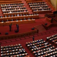 A screen shows the result of the vote on a proposal to draft a security law on Hong Kong during the closing session of the National People\'s Congress at the Great Hall of the People in Beijing on Thursday. China\'s rubber-stamp parliament endorsed plans to impose a national security law on Hong Kong that critics say will destroy the city\'s autonomy.  | AFP-JIJI