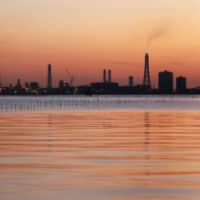 A Nippon Steel Corp. plant stands illuminated at dusk in Kimitsu, Chiba Prefecture. | BLOOMBERG