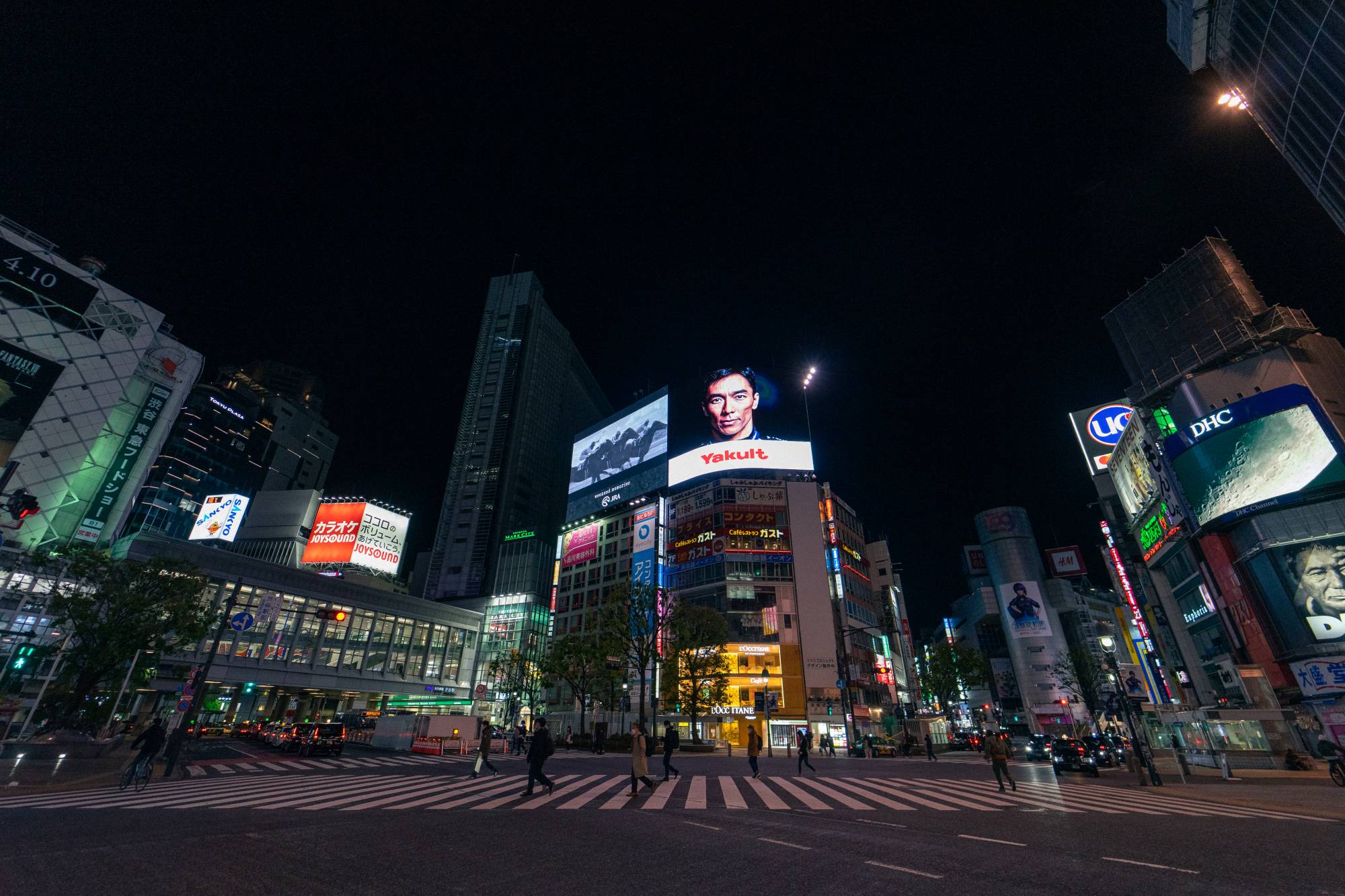 The flow of people crossing the five-way crosswalk outside Shibuya Station never really stops, but the state of emergency brought the famous crossing as close to empty as it might ever be. On a normal day, Shibuya Station serves around 2.4 million passengers, and it is estimated around 3,000 people cross here each time the pedestrian lights turn green. | Oscar Boyd