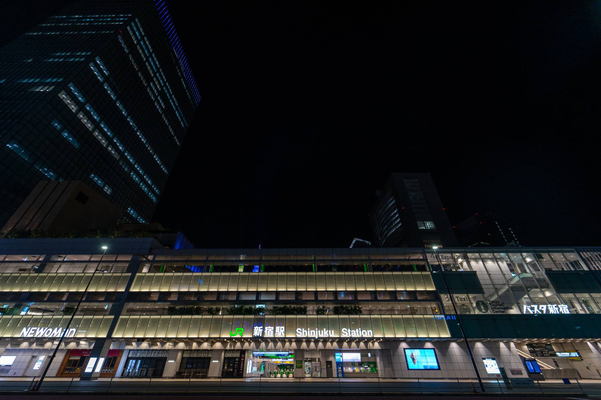 Shinjuku Station is normally the busiest in the world, connecting the western edge of central Tokyo to the outer commuter zones and prefectures. This was taken around 10 p.m. on a Tuesday night in April, when the station is usually thronged with commuters. Passenger numbers at the station fell by around 75 percent during the state of emergency, although they have risen since. | Oscar Boyd 