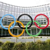 The Olympic rings are displayed outside the International Olympic Committee\'s headquarters in Lausanne, Switzerland, in March. | REUTERS / VIA KYODO
