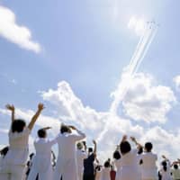 The Air Self-Defense Force\'s Blue Impulse aerobatics team passes over the Self-Defense Forces\' Central Hospital in Tokyo\'s Setagaya Ward during a flyover of the capital Friday to show appreciation to medical workers fighting the coronavirus outbreak. | KYODO