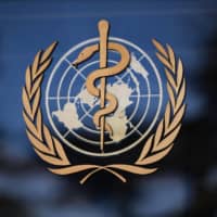 A sign at the entrance of the World Health Organization\'s headquarters in Geneva is seen last month. U.S. President Donald Trump said Friday that he was breaking off ties with the WHO, which he says failed to do enough to combat the initial spread of the novel coronavirus.  | AFP-JIJI