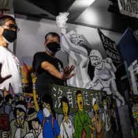 Lee Cheuk-yan (center), chairman of the Alliance in Support of Patriotic Democratic Movements of China, poses during a news conference at the June 4 Museum, dedicated to the 1989 Tiananmen Square crackdown, in Hong Kong on May 20. | AFP-JIJI