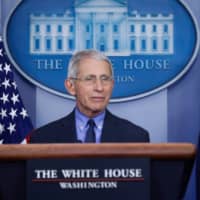 U.S. President Donald Trump looks at National Institute of Allergy and Infectious Diseases Director Dr. Anthony Fauci answers a question during the daily coronavirus task force briefing at the White House in Washington on April 17. | REUTERS