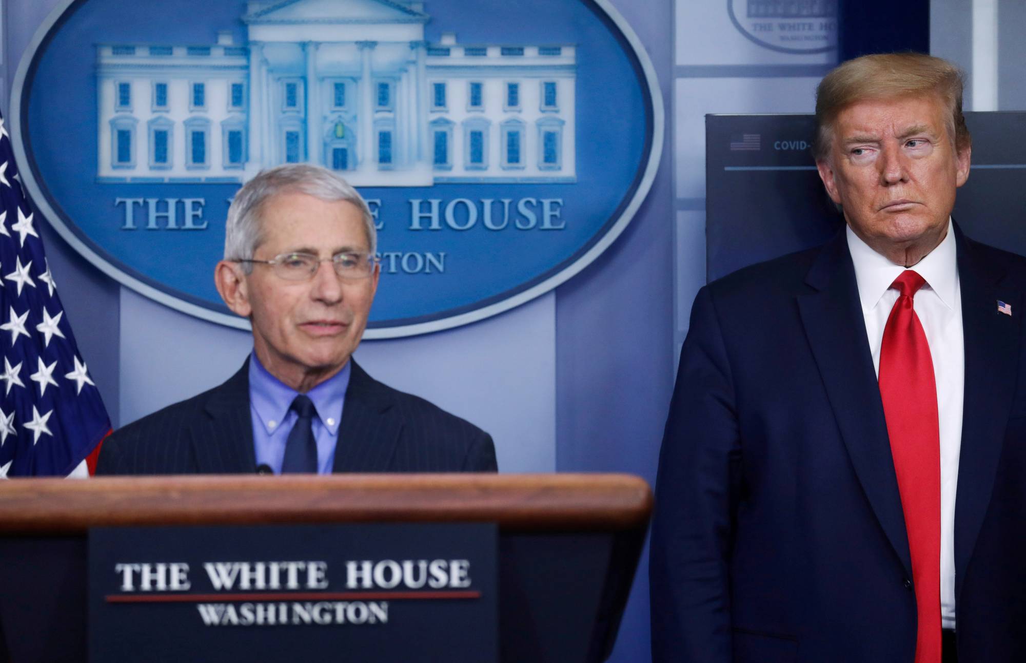 U.S. President Donald Trump looks at National Institute of Allergy and Infectious Diseases Director Dr. Anthony Fauci answers a question during the daily coronavirus task force briefing at the White House in Washington on April 17. | REUTERS
