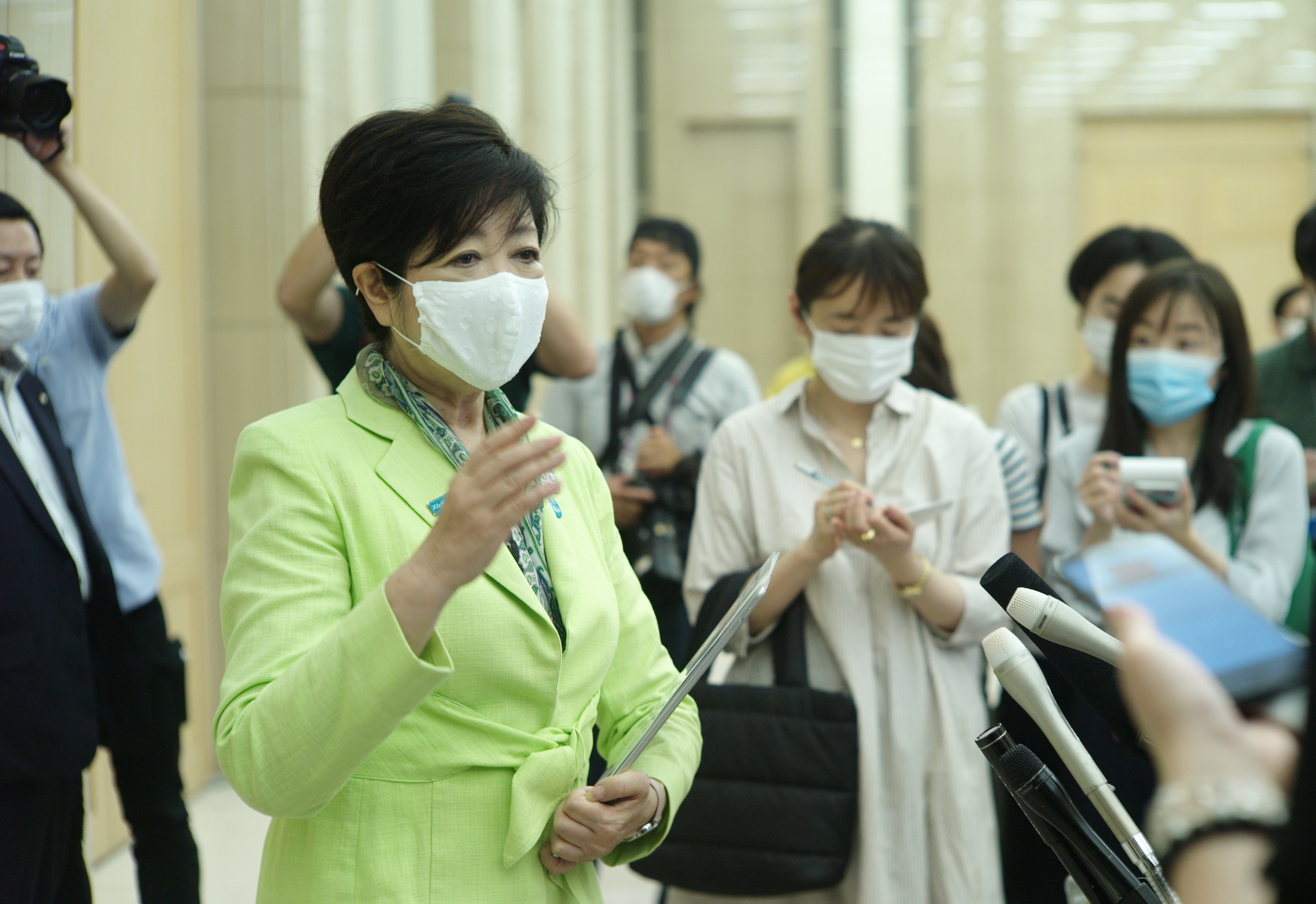Tokyo Gov. Yuriko Koike speaks to reporters as campaigning kicks off for the capital's gubernatorial election Thursday. | RYUSEI TAKAHASHI