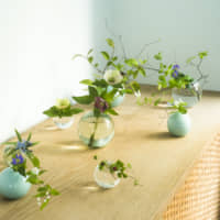 The One Flowerware bud vases are all the same shape, but made in various materials by different artisans. | YUDAI KUSANO