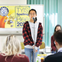 Gyuwon Shin spells a word during the bee at Tokyo YMCA International School. | TOKYO YMCA INTERNATIONAL SCHOOL
