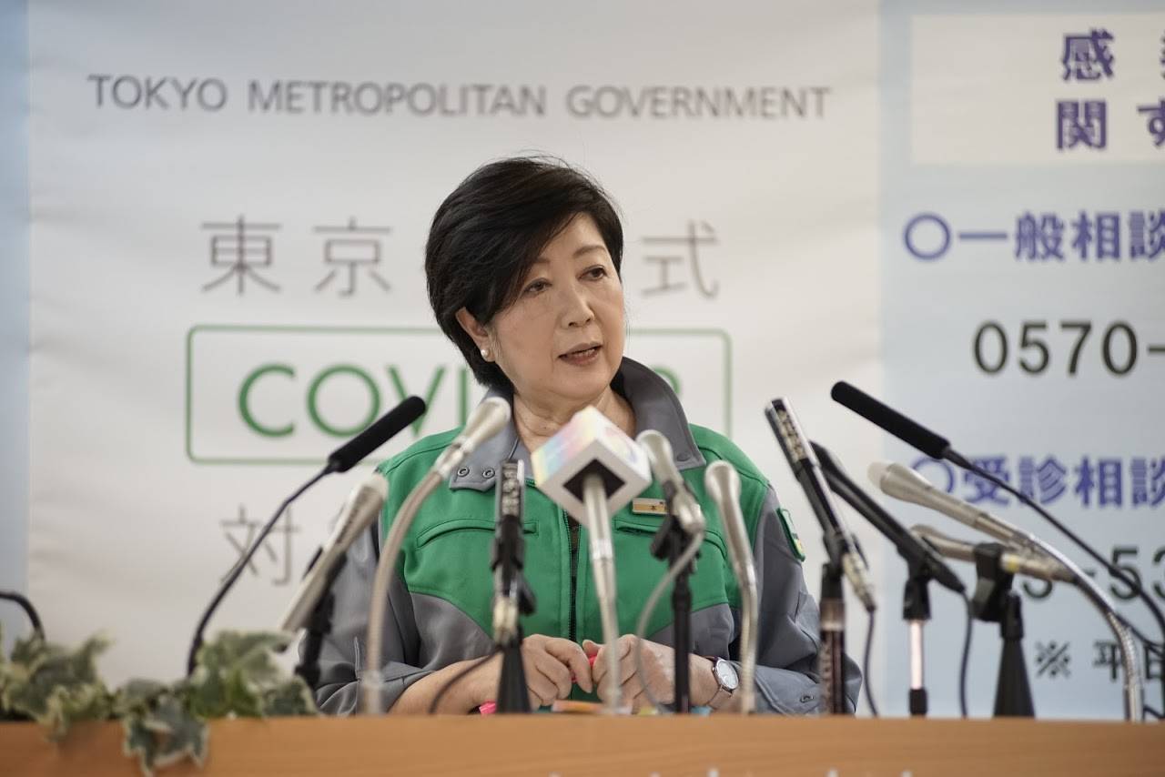 Tokyo Gov. Yuriko Koike removed her mask before speaking to the media during her weekly news conference Friday, the first time she has done so for several months. | RYUSEI TAKAHASHI