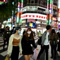 The government has warned people they must adjust to a new lifestyle, with recommendations covering everything from how to commute and shop to the right way to enjoy leisure and hobbies. | AFP-JIJI