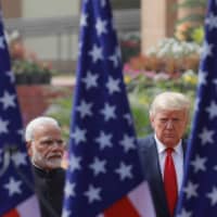 U.S. President Donald Trump and Indian Prime Minister Narendra Modi meet in February. Growing tensions between India and China present Washington with an opportunity to further strengthen ties with New Delhi, which is becoming a key ally in the U.S. effort to contain Beijing\'s Indo-Pacific ambitions.  | REUTERS