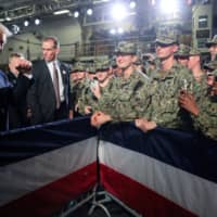 U.S. troops take photos of President Donald Trump aboard the USS Wasp at the Yokosuka naval base in Yokosuka, Kanagawa Prefecture, in May last year. | REUTERS