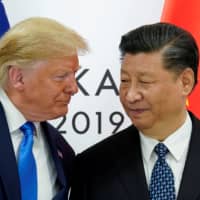 U.S. President Donald Trump meets with Chinese leader Xi Jinping at the start of their bilateral meeting at the Group of 20 leaders summit in Osaka last June. | REUTERS