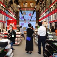 Uniqlo\'s new outlet in Tokyo\'s Harajuku district is previewed by the media Wednesday ahead of its official Friday opening. | KAZUAKI NAGATA
