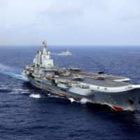 Chinese People\'s Liberation Army Navy aircraft carrier Liaoning takes part in a military drill in the western Pacific Ocean on April 18, 2018. China says it will increase its defense spending by 6.6 percent in 2020, despite a major downturn in the country\'s economic growth due to the coronavirus outbreak. | REUTERS