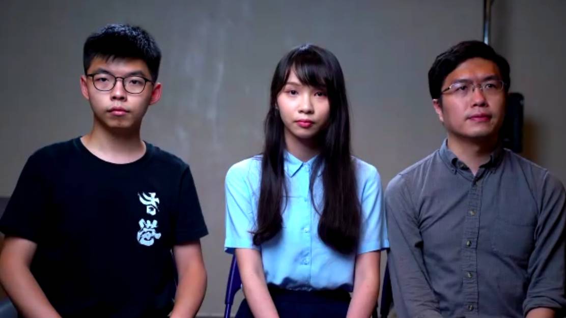 Hong Kong pro-democracy activists Joshua Wong (left), Agnes Chow (center) and Au Nok-hin give an online news conference set up by the Foreign Correspondents' Club of Japan on Wednesday. | JESSE JOHNSON 