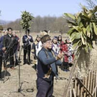 A group of Ainu, an indigenous people from Japan\'s northernmost main island of Hokkaido, pray during a ritual aimed at ending the coronavirus pandemic on April 18 in the town of Teshikaga. | KYODO

