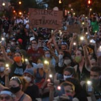 Protesters gather outside the White House on Wednesday. Protests over the death of George Floyd have brought tens of thousands of people into the streets and into close contact in cities across the U.S., sparking fears of new coronavirus transmissions.  | AFP-JIJI