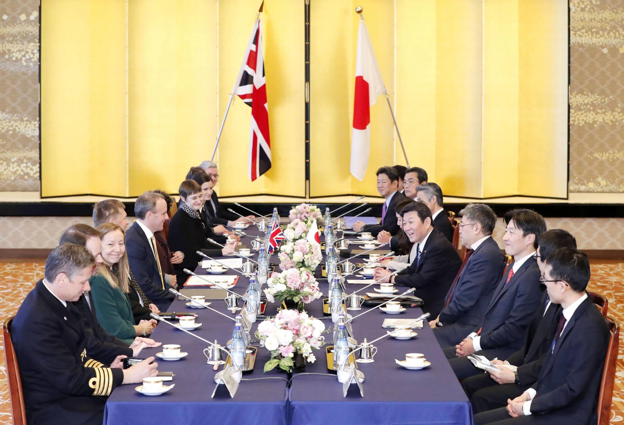 Foreign Minister Toshimitsu Motegi (fifth from right) and his British counterpart Dominic Raab (fifth from left) hold talks in Tokyo on Feb. 8. | KYODO