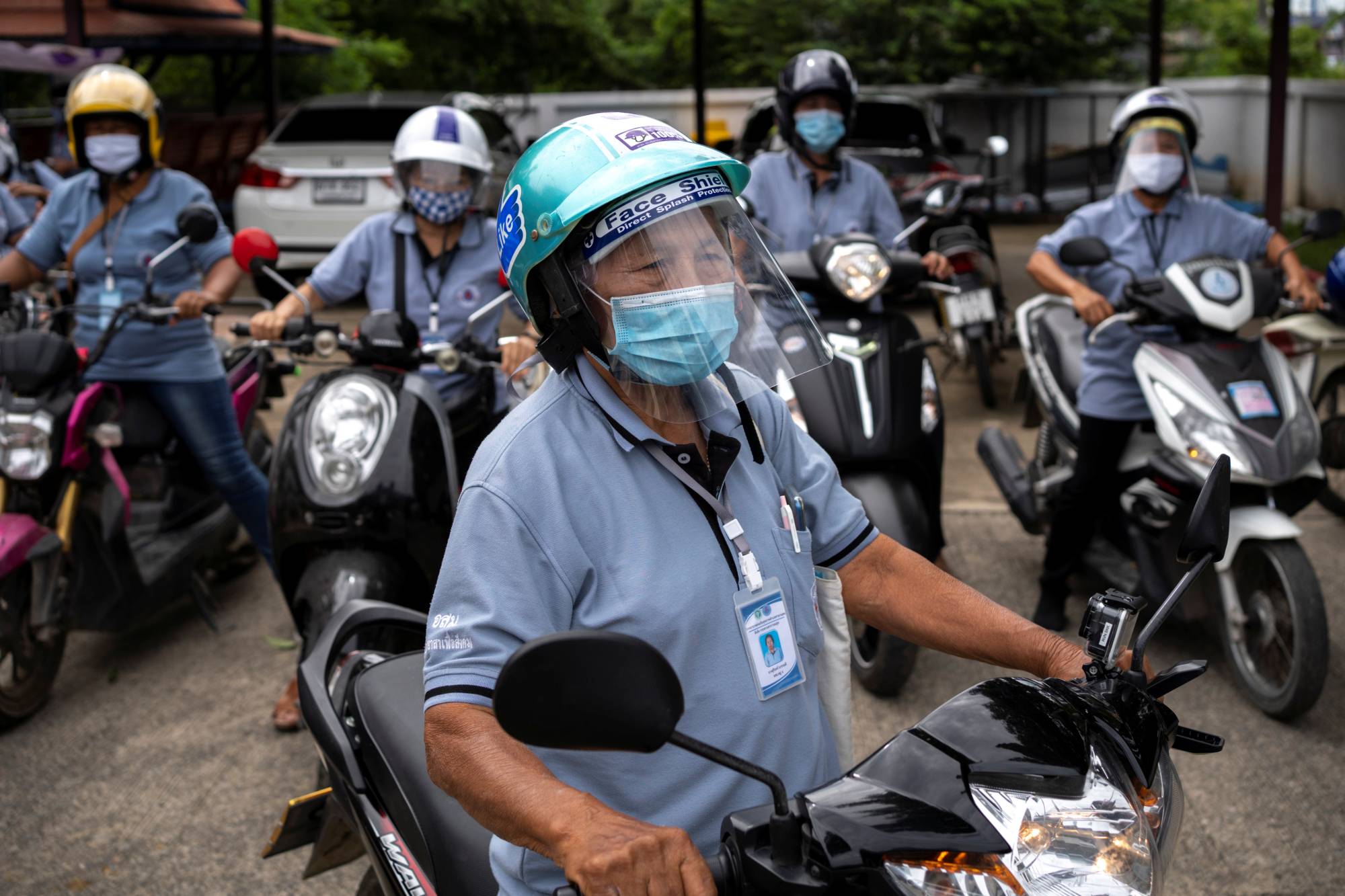 Surin Makradee, 77, is part of a network of more than 1 million community workers in Thailand who have been called 'unsung heroes' in the fight against the coronavirus.  | REUTERS