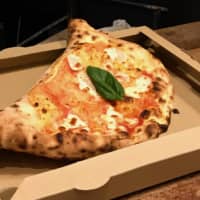 When the moon hits your eye: One of the excellent items on Fakalo Pizza Gallery\'s compact menu is a half-moon calzone. | ROBBIE SWINNERTON
