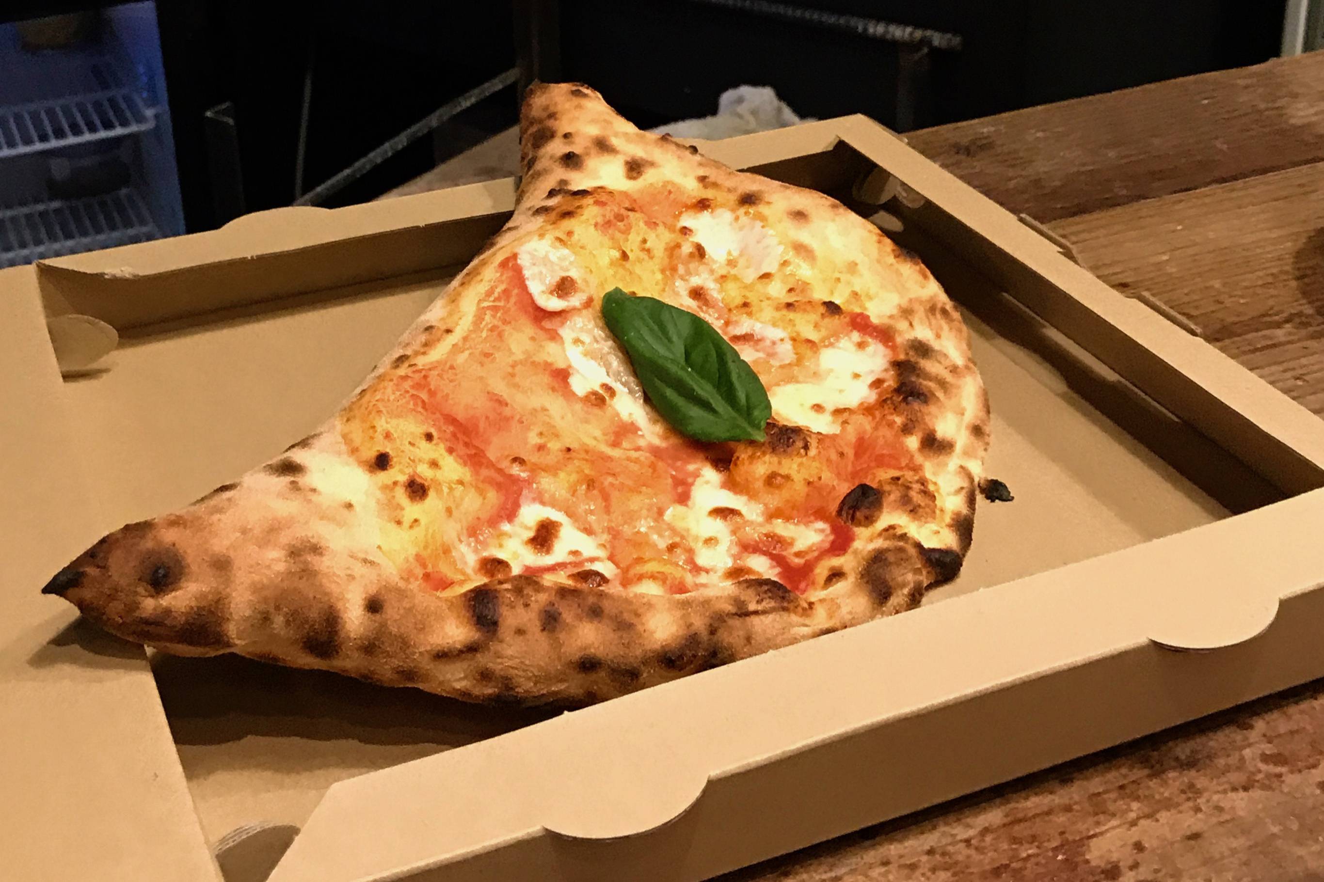 When the moon hits your eye: One of the excellent items on Fakalo Pizza Gallery's compact menu is a half-moon calzone. | Robbie Swinnerton 