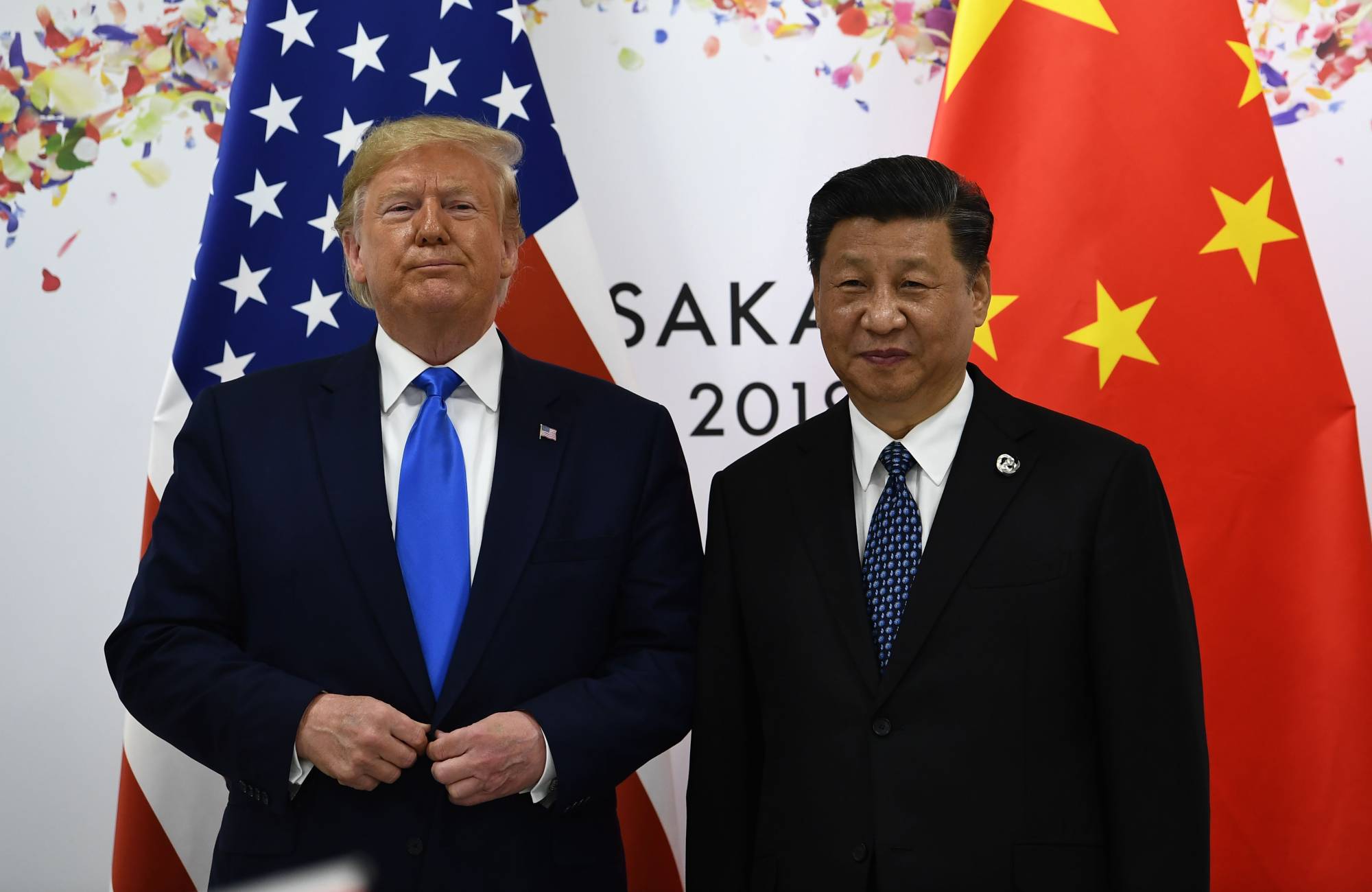 Chinese leader Xi Jinping and U.S. President Donald Trump attend a bilateral meeting on the sidelines of the Group of 20 Summit in Osaka in June last year. | AFP-JIJI