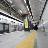 A subway train passes newly built Tokyo Metro\'s Toranomon Hills Station on the subway Hibiya Line Tuesday ahead of its opening Saturday. | KYODO