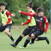 Grampus players train on June 1 in Toyota, Aichi Prefecture. | KYODO